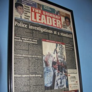 A framed copy of the first edition of the Leader published after former editor Lasantha Wickrematunge's death