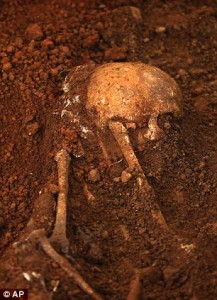 Judicial medical officer Asoka Jayasena carries a skull of an unearthed skeleton. The country has seen two major uprisings from Marxist guerrillas