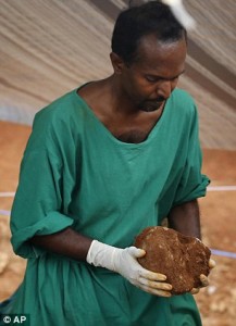 Judicial medical officer Asoka Jayasena carries a skull of an unearthed skeleton. The country has seen two major uprisings from Marxist guerrillas