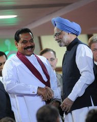 Manmohan Singh, right, prime minister of India with Mahinda Rajapaksa, president of Sri Lanka, during the Commonwealth Games closing ceremony in New Delhi, on Oct. 14, 2010.