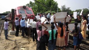 Pro-government activists block a train carrying Britain's Channel 4 television crew who made an award-winning documentary on alleged war crimes in Sri Lanka