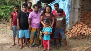 Uncertain future ... the repatriated Sri Lankan asylum seekers -  Hemantha Kuruppu (third from left), Janaka Gayan Athukorala (forth from left), and Sujeewa Saparamadu (second from right) - and their families.