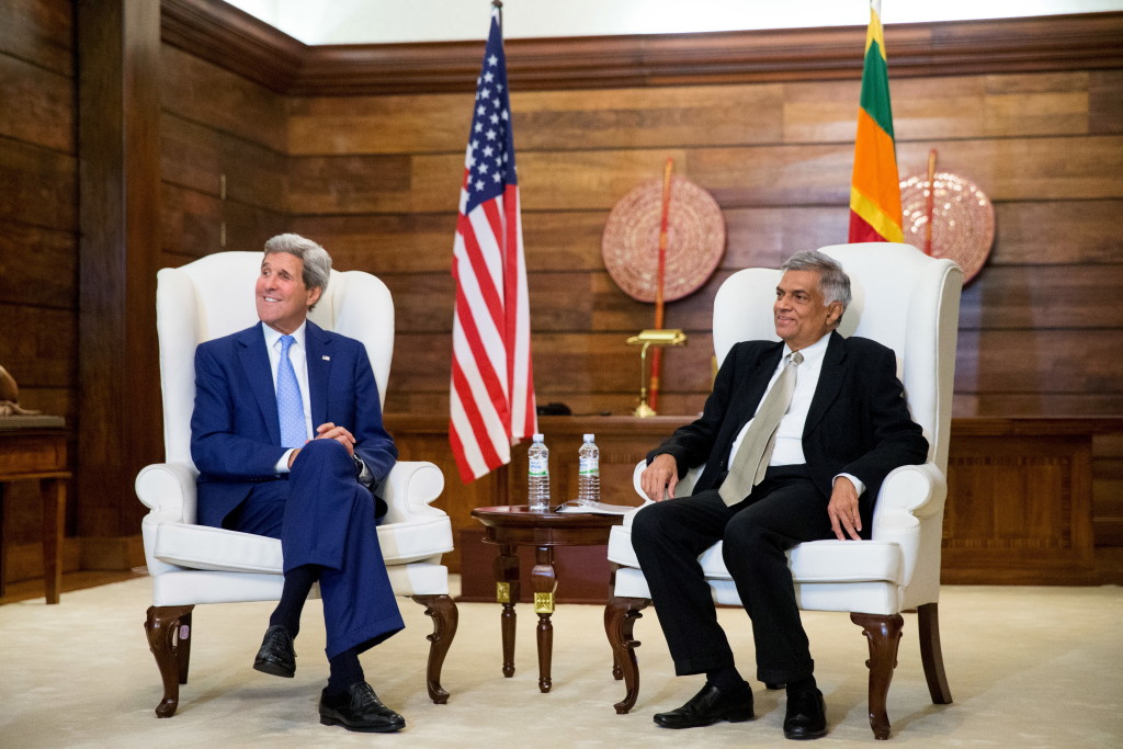 U.S. Secretary of State John Kerry (L) sits next to Sri Lankan Prime Minister Ranil Wickremesinghe in Colombo, Sri Lanka, May 2, 2015. Kerry’s visit to Sri Lanka is the first by a U.S. Secretary of state in a decade. Photo by Andrew Harnik/Reuters