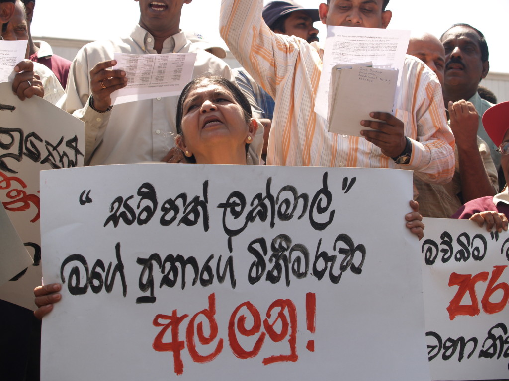 FMM photo: Lakmal's mother holding the above placard