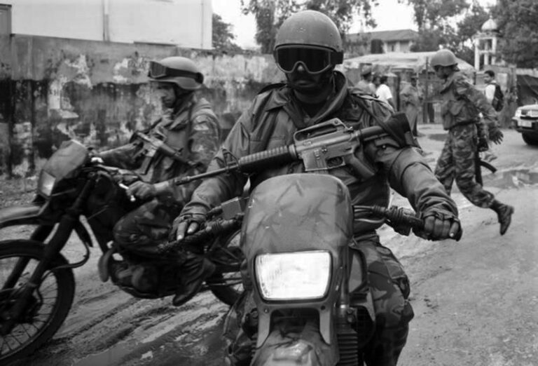 The  symbolism of armed motorcycle riders, clad in black, doing covid-19 temperature checks in Sri Lanka – Kishali Pinto Jayawardene